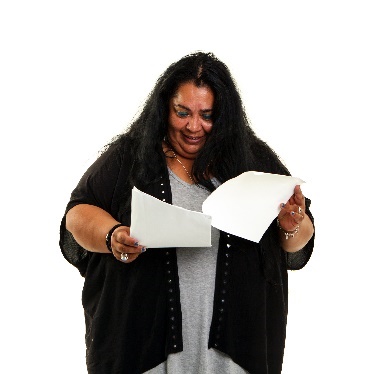 A person turning pages in a document. 