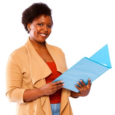 A person smiling, holding a document open. 