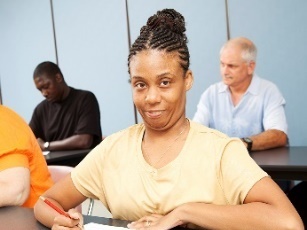 A woman learning in class.