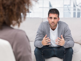 A man talking to a therapist. 