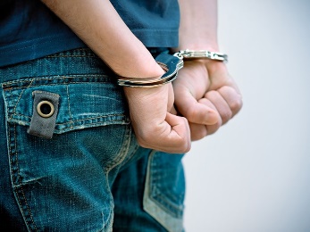 A person in handcuffs.