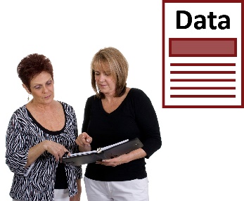 Two women reading a document and a data icon.
